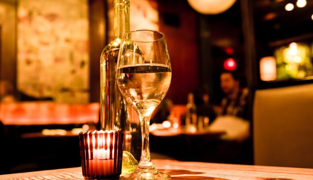 Romantic atmosphere at New Orleans Restaurant with candles and wine glass | Romantic restaurants in New Orleans