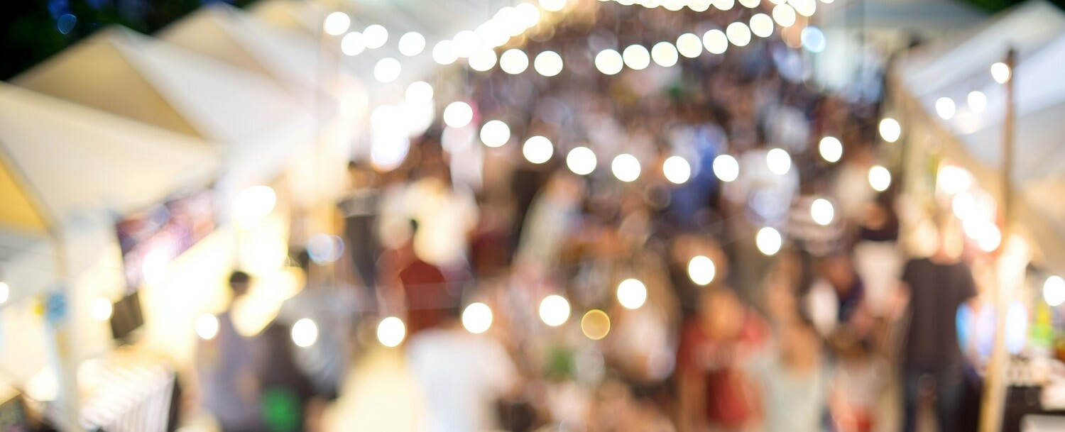 blurry picture of a street festival