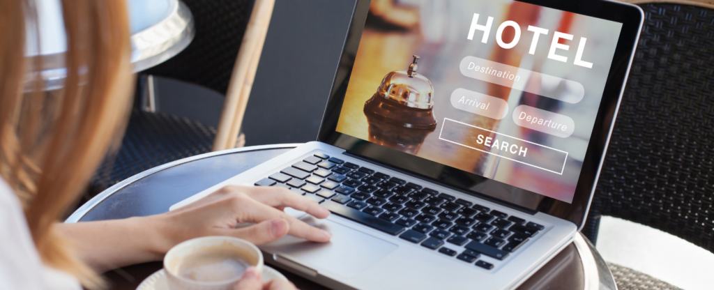 woman looking at hotel on laptop