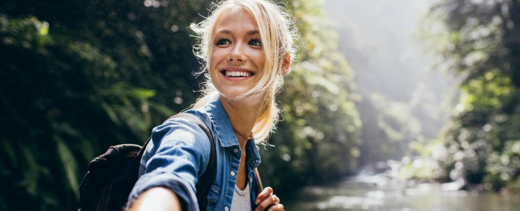 woman smiling on hike