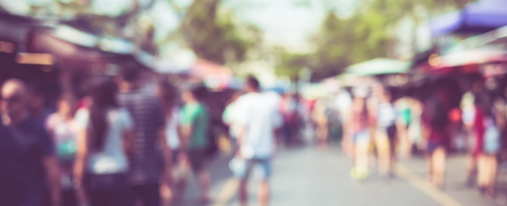 blurry photo of people at street festival