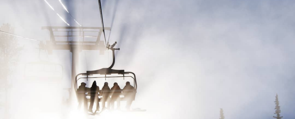 group of people on a ski lift