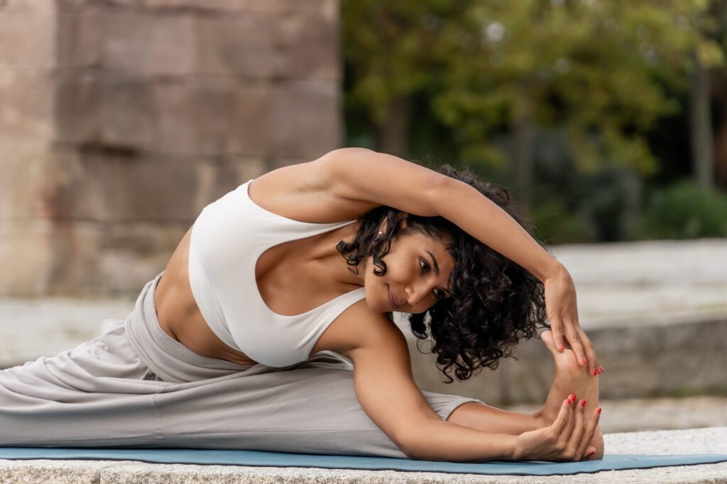Closeup of a woman practicing yoga outdoors