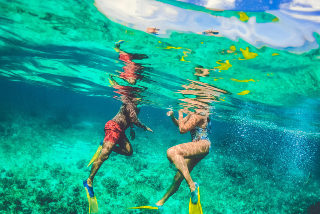 Man and woman snorkeling underwater 2