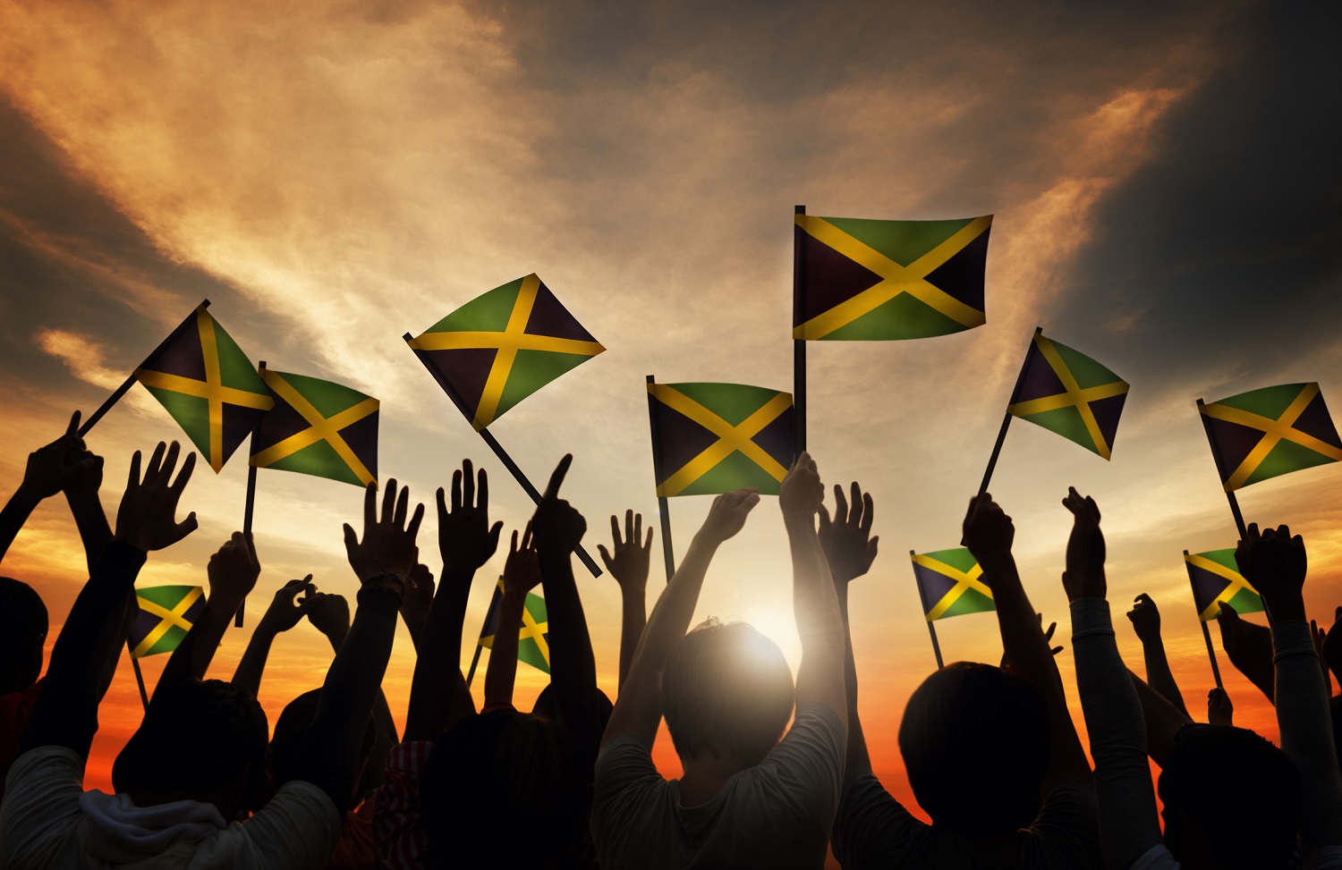 Group of People Waving the Flag of Jamaica