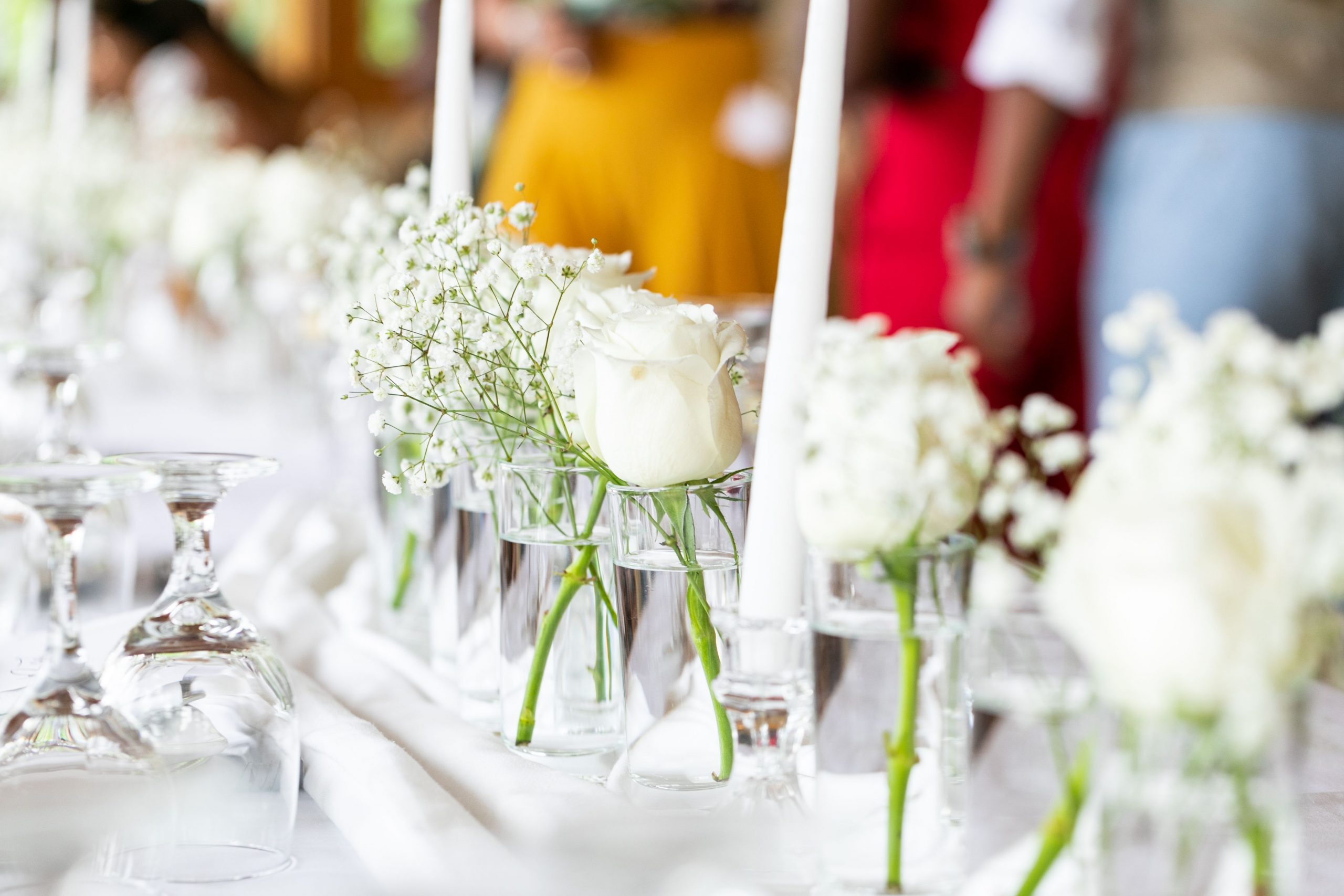 Wedding flowers on table with white tablecloth