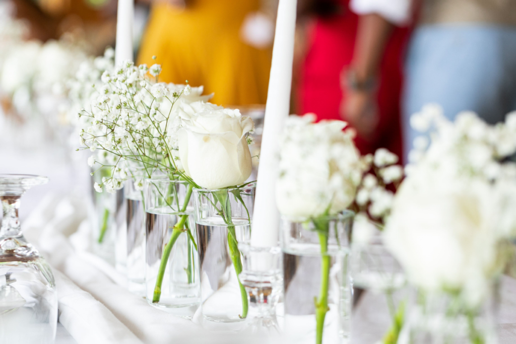 Wedding flowers on table with white tablecloth