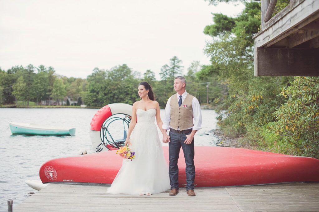 wedding couple in front of the Oneka Canoe