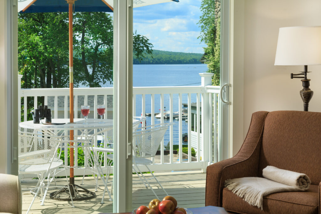 a lake view from a cottage living room in the poconos