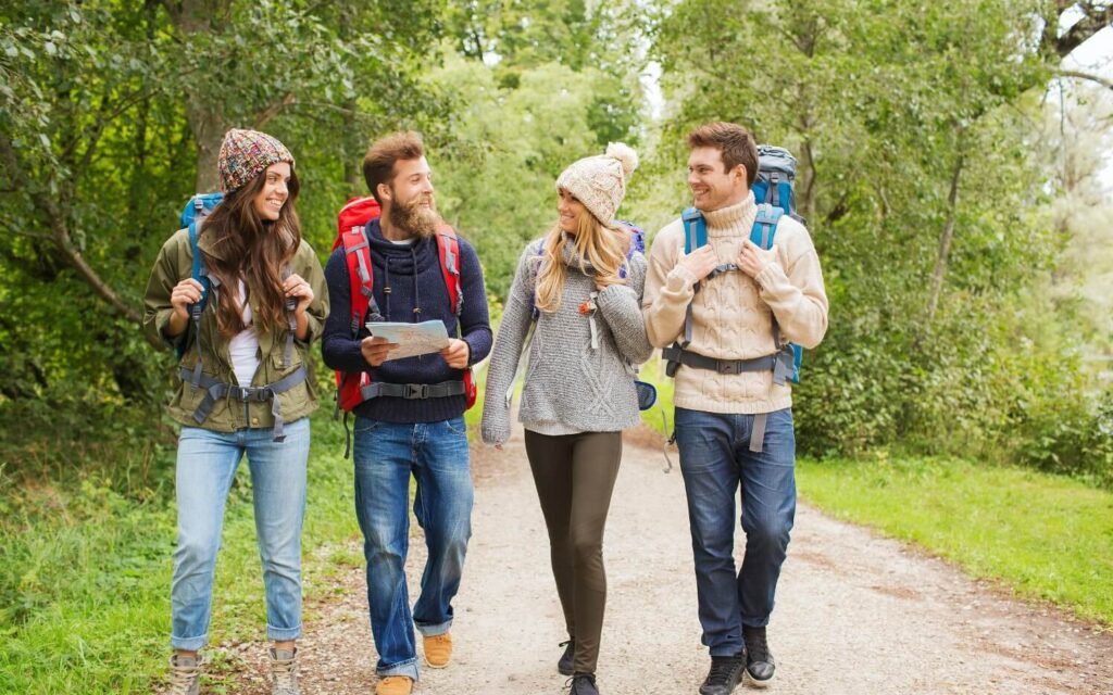 a group of four young adults enjoying hiking in the poconos mountains