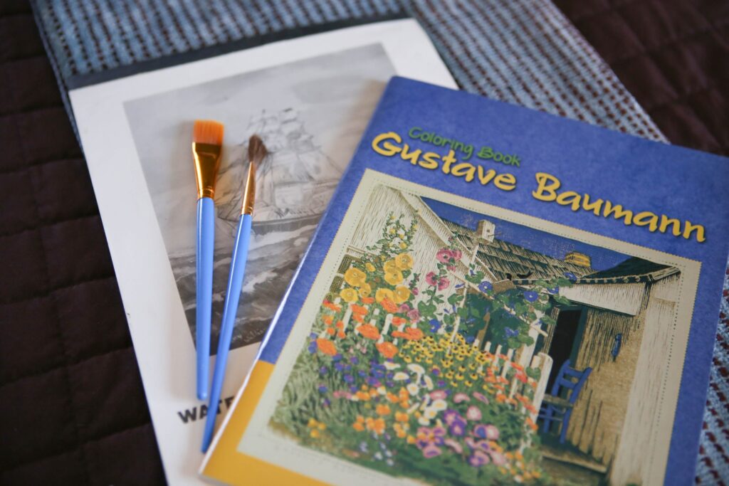 gustave baumann painting book with paintbrushes