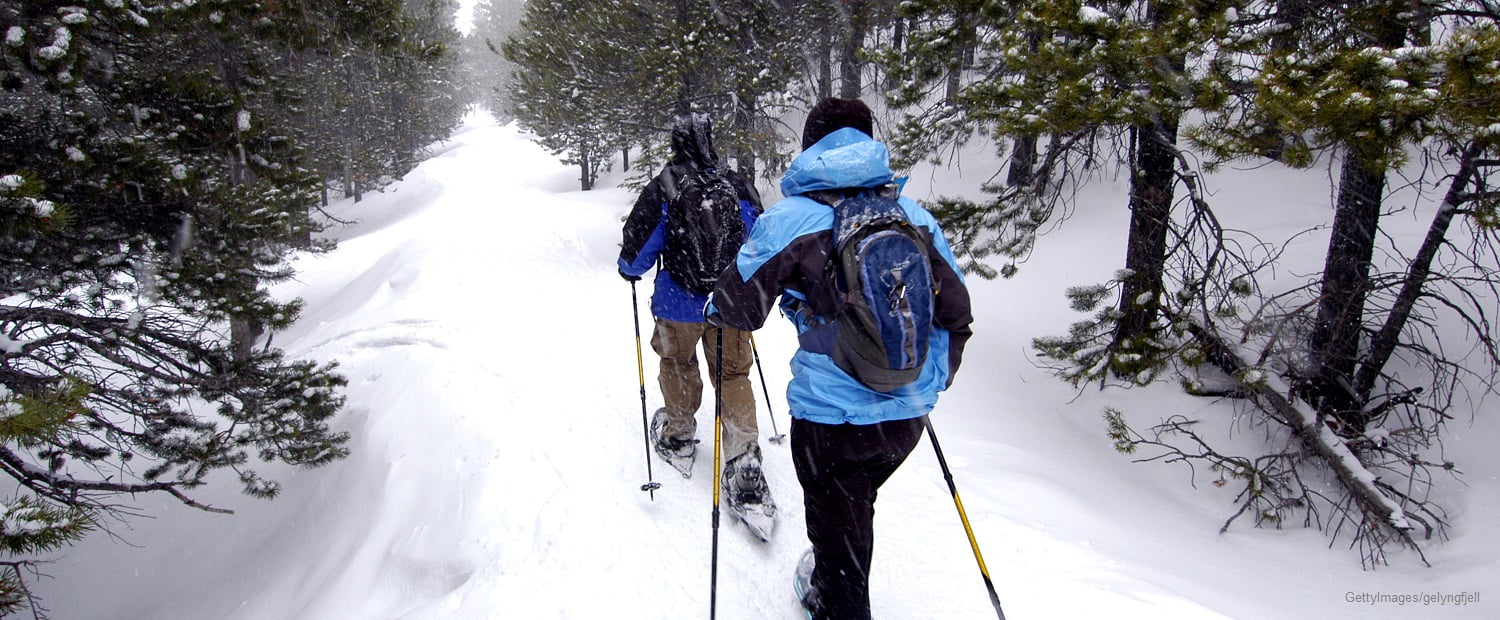 Couple snowshoeing in the Colorado mountains