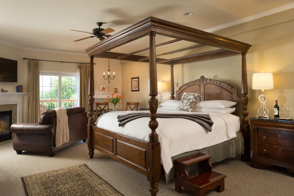 private suite at The French Manor Inn & spac with four-poster bed