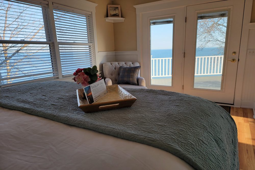 suite bed looking out at the lake