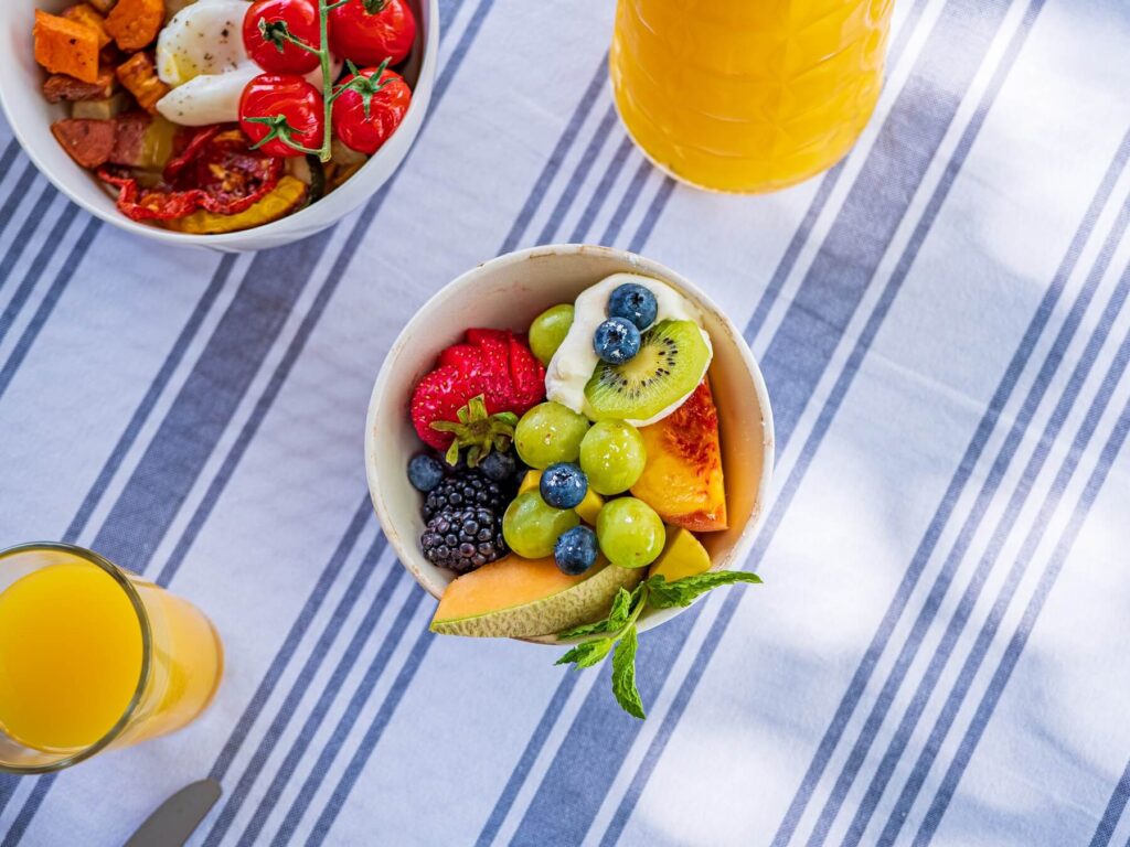 Breakfast Bowls on table with orange juices