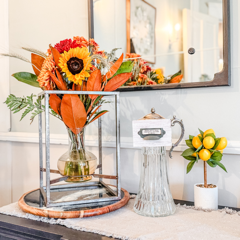 Dining room fall arrangement with sunflowers and glass pitcher at Magpie Inn, Mineral Wells