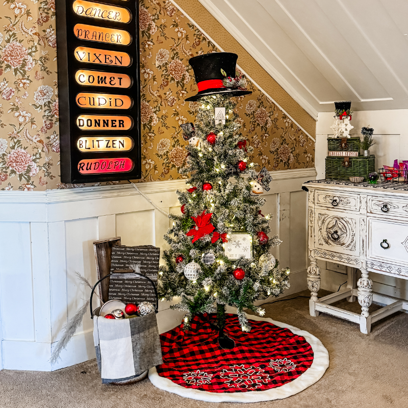 A lit Christmas tree in the Magpie Inn parlor with garlands and seasonal accents, highlighted in December Notes from the Nest.