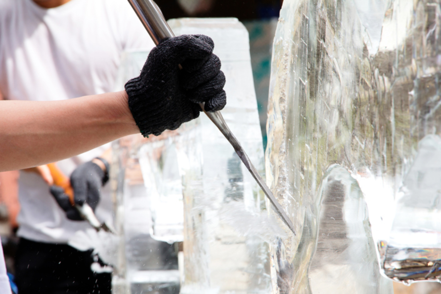 Ice Carver Creating Ice Sculpture for the Leavenworth Ice Fest