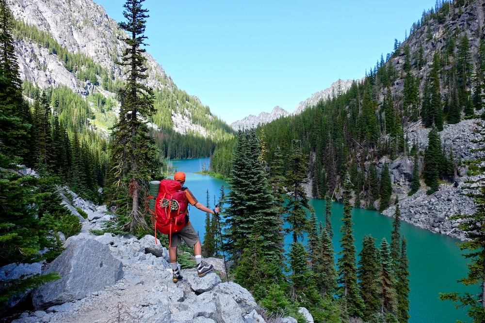 person hiking by a river in the pacific northwest