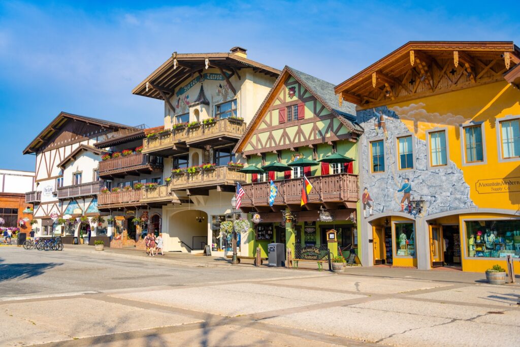 Leavenworth, Washington, USA - July 22, 2024: Quaint Bavarian building in old town. Bavarian village. Bavarian village of Leavenworth, Washington with themed sidewalk shop on the street