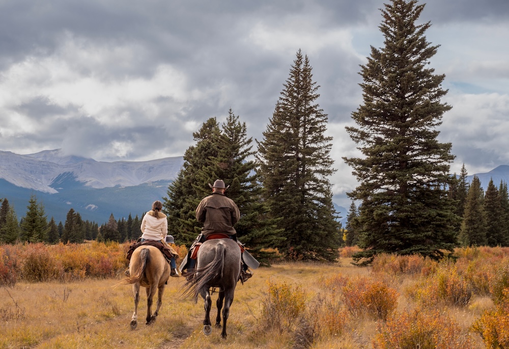 couple horseback riding 