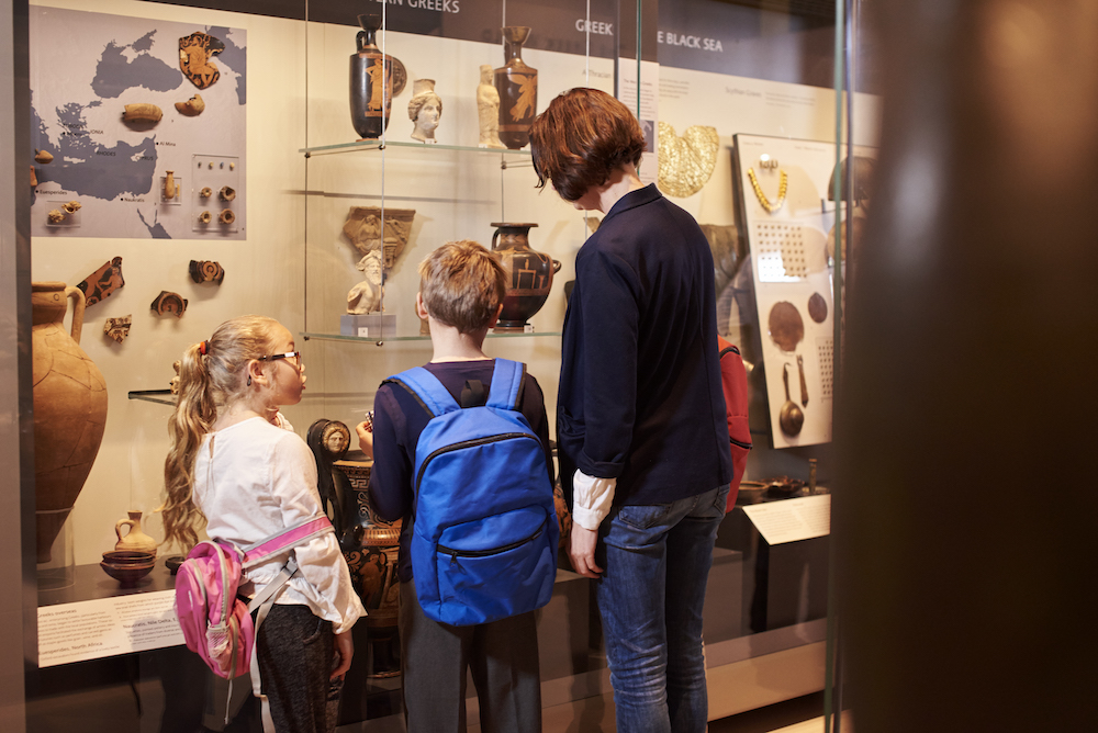 mother and children at a museum